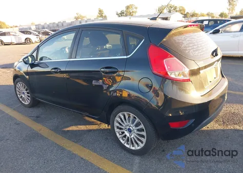 2015 Ford Fiesta Titanium from USA, damaged, VIN 3FADP4FJ7FM110639